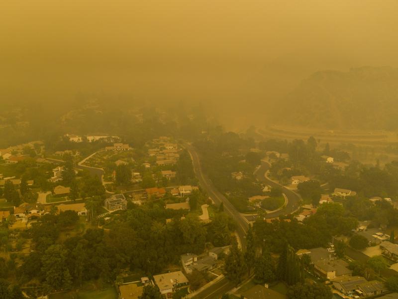 Climate change has been a key factor in increasing the risk and extent of wildfires and other catastrophic weather events. Here, an aerial view shows neighborhoods in Monrovia, Calif., shrouded in smoke from the Bobcat Fire in September. Climate change has been a key factor in increasing the risk and extent of wildfires and other catastrophic weather events. Here, an aerial view shows neighborhoods in Monrovia, Calif., shrouded in smoke from the Bobcat Fire in September.