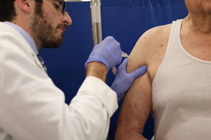 Pharmacist Raphael Lynne gives a flu shot in Miami in 2018. This year's vaccination against influenza has been reducing infections by "about 40 to 50 percent," says Emily Martin, an epidemiologist with the University of Michigan School of Public Health. Pharmacist Raphael Lynne gives a flu shot in Miami in 2018. This year's vaccination against influenza has been reducing infections by "about 40 to 50 percent," says Emily Martin, an epidemiologist with the University of Michigan School of Public Health.