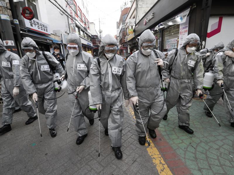 Korean soldiers spray disinfectant as a precaution against the coronavirus on a shopping street in Seoul, South Korea, last week. U.S. military stationed in South Korea and Italy have been ordered not to travel because of the outbreak. Korean soldiers spray disinfectant as a precaution against the coronavirus on a shopping street in Seoul, South Korea, last week. U.S. military stationed in South Korea and Italy have been ordered not to travel because of the outbreak.