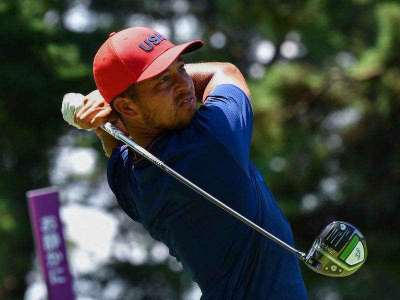 USA's Xander Schauffele watches his drive from the 5th tee in the final round of the men's golf tournament during the Tokyo Olympics on Sunday. USA's Xander Schauffele watches his drive from the 5th tee in the final round of the men's golf tournament during the Tokyo Olympics on Sunday.