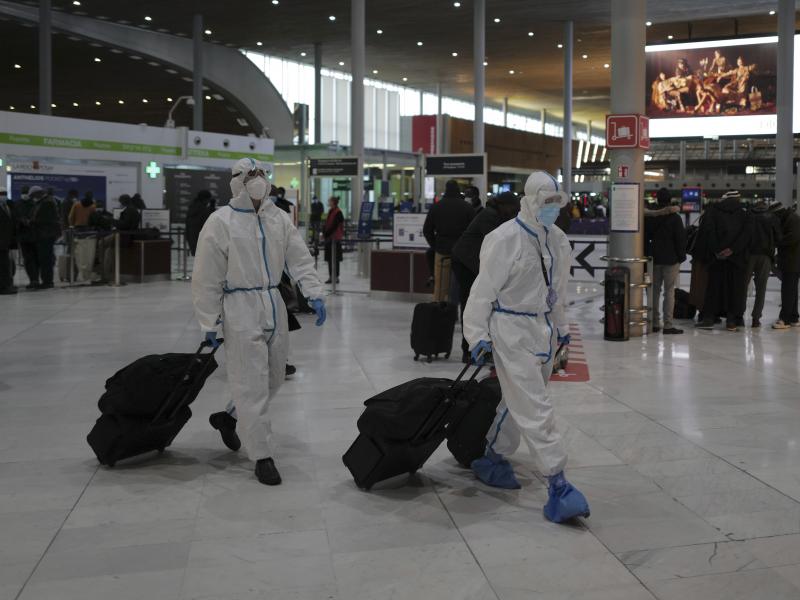 Global travel continues to be risky because of the coronavirus. Earlier this year, passengers from Taiwan wear protective gear as they arrive at France's Charles de Gaulle Airport, and just this week, the U.S. issued over 100 new travel advisories. Global travel continues to be risky because of the coronavirus. Earlier this year, passengers from Taiwan wear protective gear as they arrive at France's Charles de Gaulle Airport, and just this week, the U.S. issued over 100 new travel advisories.