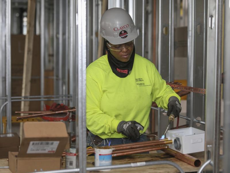 Plumber Zakiyyah Askia welds pipes at a high-rise residence under construction in Chicago on Jan. 24. U.S. employers added 196,000 jobs in March, a rebound from February's weak growth, the Labor Department said Friday. Plumber Zakiyyah Askia welds pipes at a high-rise residence under construction in Chicago on Jan. 24. U.S. employers added 196,000 jobs in March, a rebound from February's weak growth, the Labor Department said Friday.