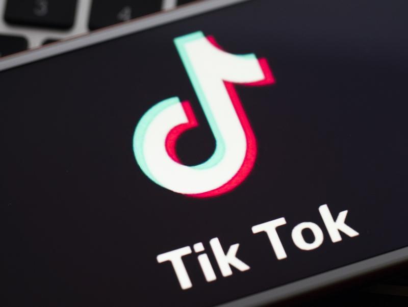 In this photo illustration a mobile phone screen displays TikTok logo in front of a keyboard. In this photo illustration a mobile phone screen displays TikTok logo in front of a keyboard.