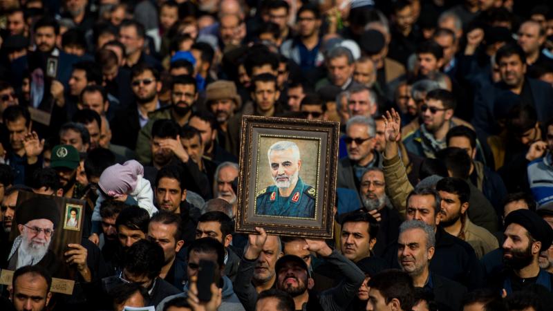 The U.S. killed Iranian Maj. Gen. Qassem Soleimani in a targeted drone strike in Baghdad. A U.N. investigator says the action violated Iraq's sovereignty. Here, protesters in Tehran, Iran, hold up an image of Soleimani during a demonstration on Jan. 3. The U.S. killed Iranian Maj. Gen. Qassem Soleimani in a targeted drone strike in Baghdad. A U.N. investigator says the action violated Iraq's sovereignty. Here, protesters in Tehran, Iran, hold up an image of Soleimani during a demonstration on Jan. 3.