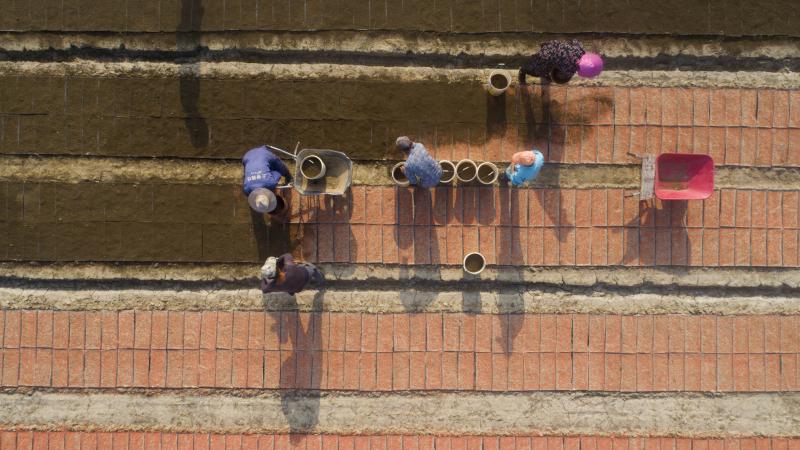 The new U.S. tariffs list includes staples such as rice, along with clocks, watches and other items that weren't previously under threat of new duties. Here, farmers plant rice seeds at a seedlings pool in China's Jiangsu province. The new U.S. tariffs list includes staples such as rice, along with clocks, watches and other items that weren't previously under threat of new duties. Here, farmers plant rice seeds at a seedlings pool in China's Jiangsu province.