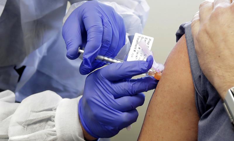 A volunteer receives a shot in a clinical trial for a potential coronavirus vaccine. U.S. intelligence officials say Russian hackers are attempting to break into U.S. health care organizations working on a vaccine. A volunteer receives a shot in a clinical trial for a potential coronavirus vaccine. U.S. intelligence officials say Russian hackers are attempting to break into U.S. health care organizations working on a vaccine.
