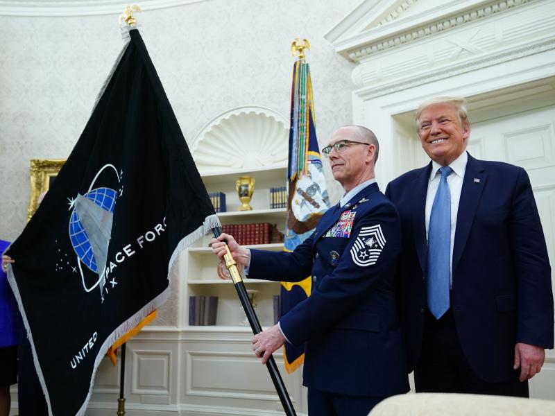 President Trump presedisplays the U.S. Space Force flag in the Oval Office last May. The new command plans to move its headquarters from a temporary location in Colorado to Alabama in 2023. President Trump presedisplays the U.S. Space Force flag in the Oval Office last May. The new command plans to move its headquarters from a temporary location in Colorado to Alabama in 2023.