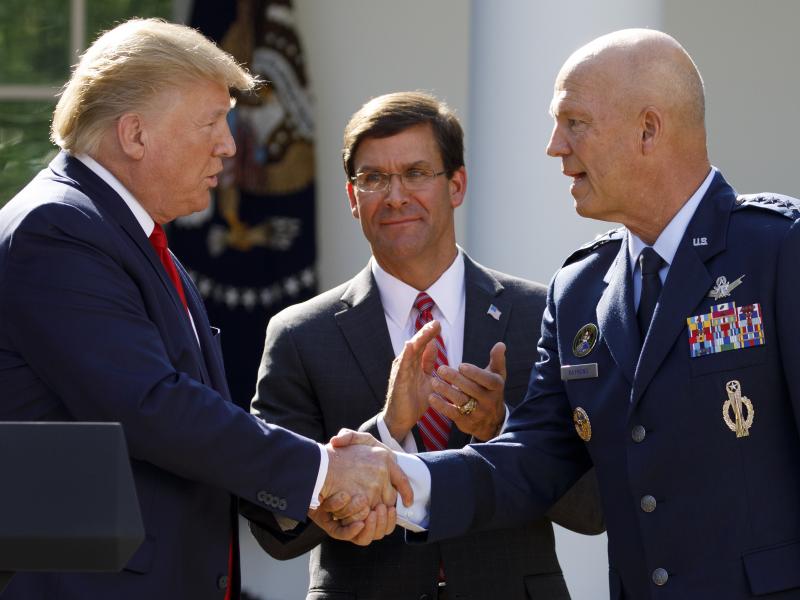 Gen. John "Jay" Raymond, with President Trump and Defense Secretary Mark Esper during a ceremony to establish the U.S. Space Command last summer. Gen. John "Jay" Raymond, with President Trump and Defense Secretary Mark Esper during a ceremony to establish the U.S. Space Command last summer.