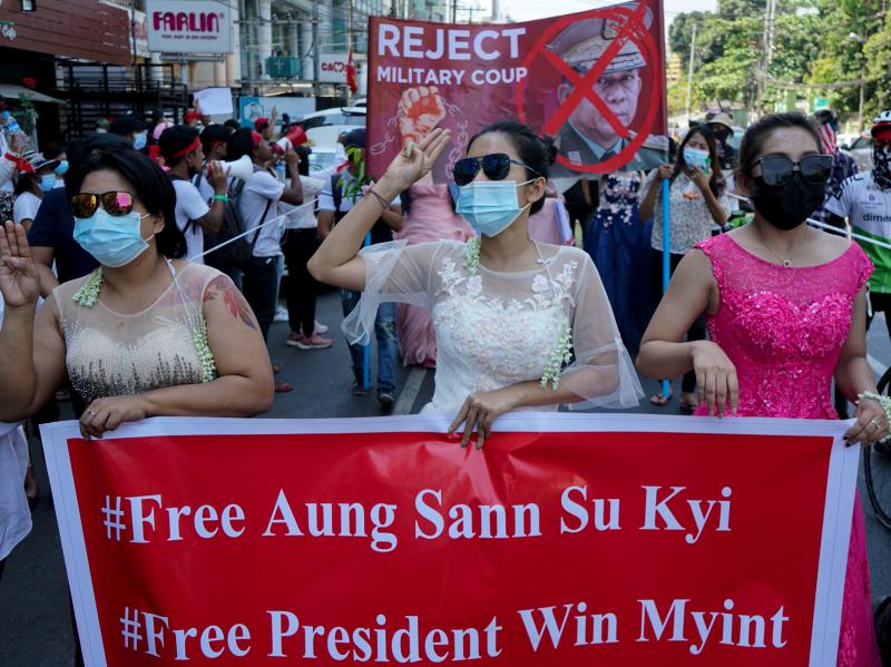 Women protest on Wednesday against the military coup that toppled the government led by Aung San Suu Kyi earlier this month. The Biden administration on Thursday announced sanctions against several of the coup leaders. Women protest on Wednesday against the military coup that toppled the government led by Aung San Suu Kyi earlier this month. The Biden administration on Thursday announced sanctions against several of the coup leaders.