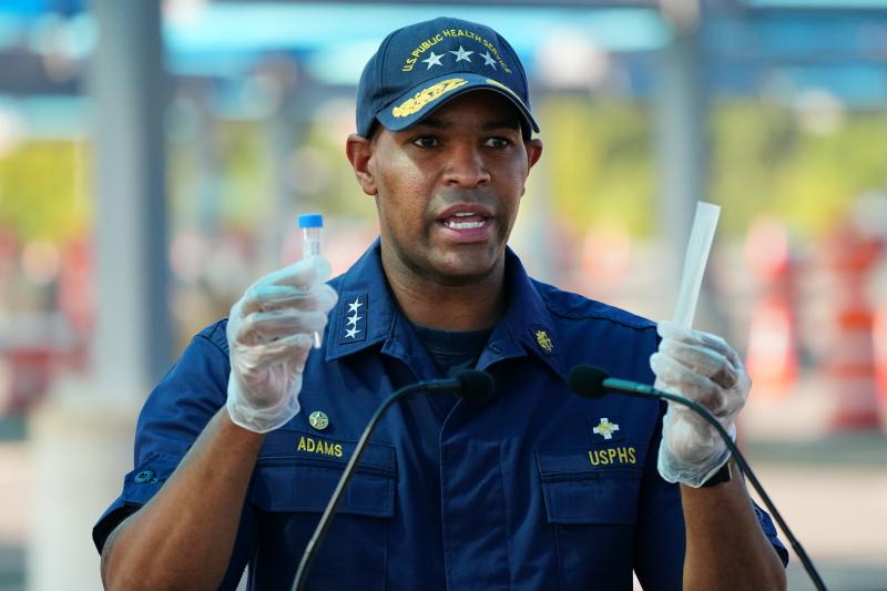 U.S. Surgeon General Jerome Adams demonstrates how to use a COVID-19 self-test kit during a press conference in Atlanta in August. U.S. Surgeon General Jerome Adams demonstrates how to use a COVID-19 self-test kit during a press conference in Atlanta in August.