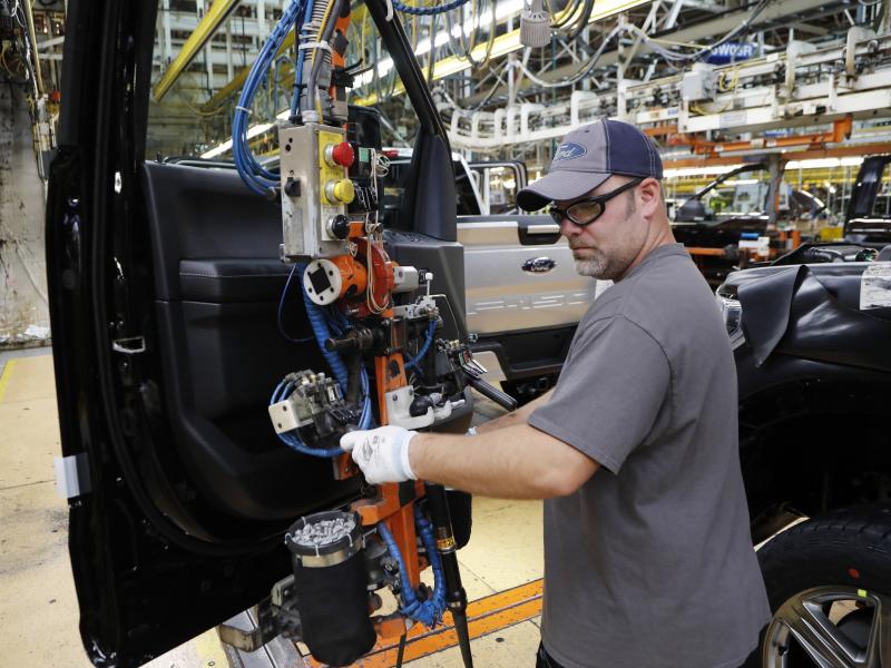A worker installs a door on a 2018 Ford F-150 truck at an assembly plant in Dearborn, Mich., on Sept. 27. The U.S. unemployment rate fell to 3.7 percent in September, a nearly 50-year low. A worker installs a door on a 2018 Ford F-150 truck at an assembly plant in Dearborn, Mich., on Sept. 27. The U.S. unemployment rate fell to 3.7 percent in September, a nearly 50-year low.