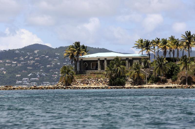 A view of Jeffrey Epstein's stone mansion on Little St. James Island. Prosecutors in the Virgin Islands on Tuesday filed a civil lawsuit that accuses Epstein of human trafficking that victimized young women and children as young as 11 years old. Some of t A view of Jeffrey Epstein's stone mansion on Little St. James Island. Prosecutors in the Virgin Islands on Tuesday filed a civil lawsuit that accuses Epstein of human trafficking that victimized young women and children as young as 11 years old. Some of t