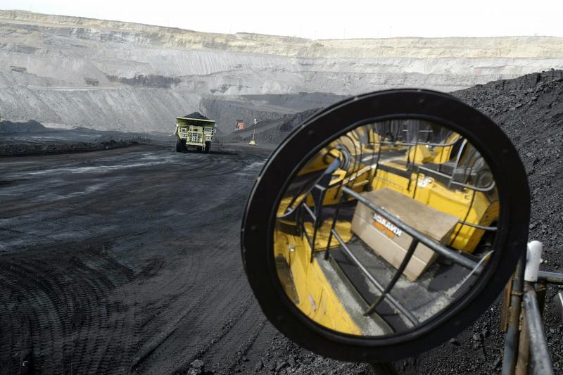A coal-hauling truck with 240 tons of coal drives to the surface at the Buckskin Coal Mine in Gillette, Wyo., in 2004. A coal-hauling truck with 240 tons of coal drives to the surface at the Buckskin Coal Mine in Gillette, Wyo., in 2004.