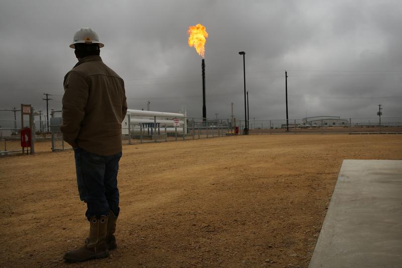 Flared natural gas is burned off at Apache Corporation's operations at the Deadwood natural gas plant in Garden City, Texas, on Feb. 5, 2015. Flared natural gas is burned off at Apache Corporation's operations at the Deadwood natural gas plant in Garden City, Texas, on Feb. 5, 2015.