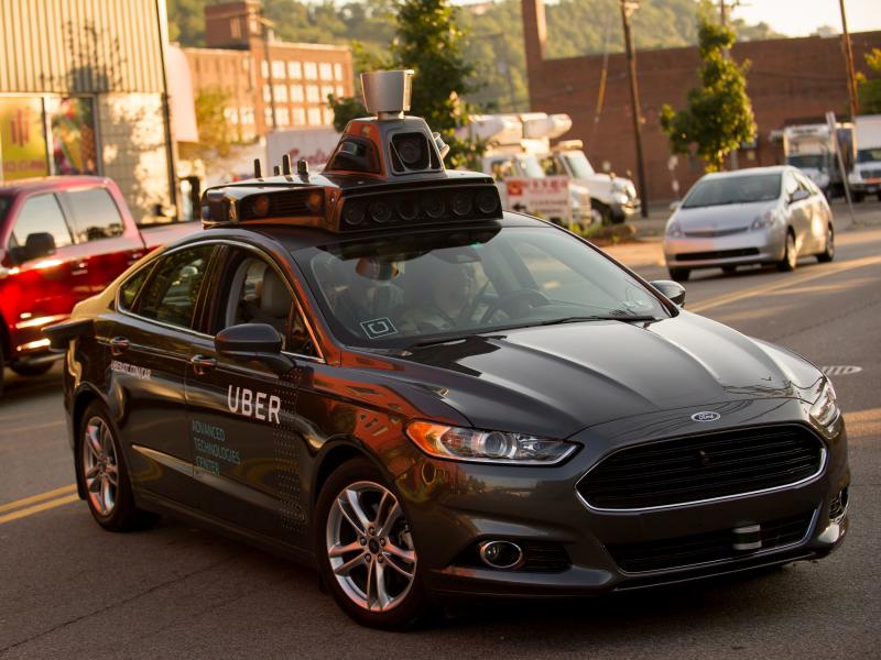 An Uber driverless Ford Fusion drives in Pittsburgh in 2016. On Friday, Uber and Google's Waymo self-driving unit announced a settlement in their trade secrets case. An Uber driverless Ford Fusion drives in Pittsburgh in 2016. On Friday, Uber and Google's Waymo self-driving unit announced a settlement in their trade secrets case.