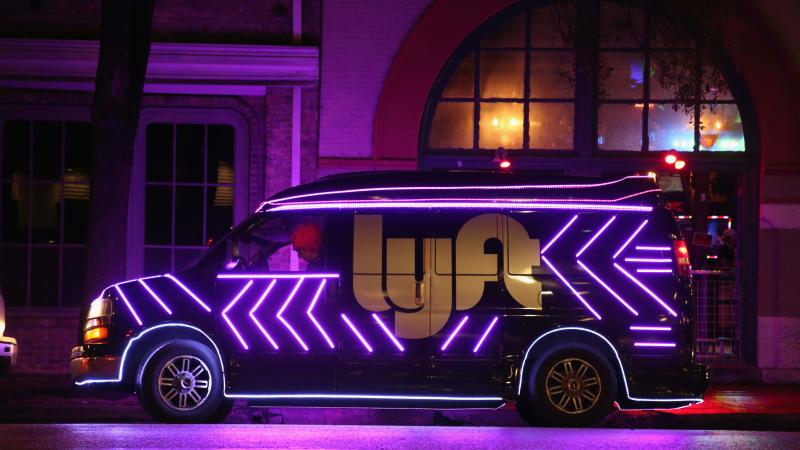 A Lyft van sits outside the Austin Convention Center in March, during the 2016 SXSW Festival. The ride-hailing company, along with its competitor Uber, has now vowed to "pause" operations in the city, after Austin voters sided against the ride-hailing app A Lyft van sits outside the Austin Convention Center in March, during the 2016 SXSW Festival. The ride-hailing company, along with its competitor Uber, has now vowed to "pause" operations in the city, after Austin voters sided against the ride-hailing app