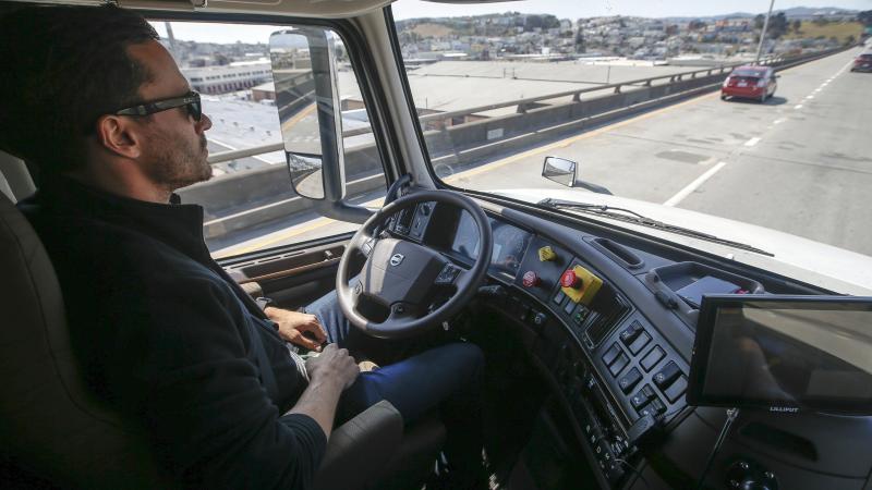 Two years after Uber paid $680 million to buy the self-driving truck startup Otto, the company is folding that effort. In this photo from 2016, an Otto engineer sits behind the steering wheel of a self-driving, big-rig truck during a demonstration in San Two years after Uber paid $680 million to buy the self-driving truck startup Otto, the company is folding that effort. In this photo from 2016, an Otto engineer sits behind the steering wheel of a self-driving, big-rig truck during a demonstration in San