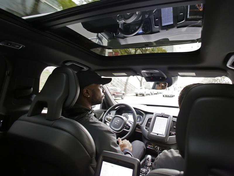 Devin Greene sits in the front seat of an Uber driverless car during a test drive in San Francisco on Dec. 13. Devin Greene sits in the front seat of an Uber driverless car during a test drive in San Francisco on Dec. 13.