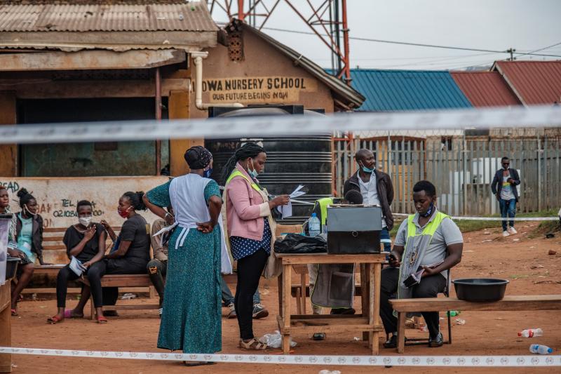 Ugandan election commission officials count ballots after the polls closed at a polling station in Kampala on Thursday. Ugandan election commission officials count ballots after the polls closed at a polling station in Kampala on Thursday.