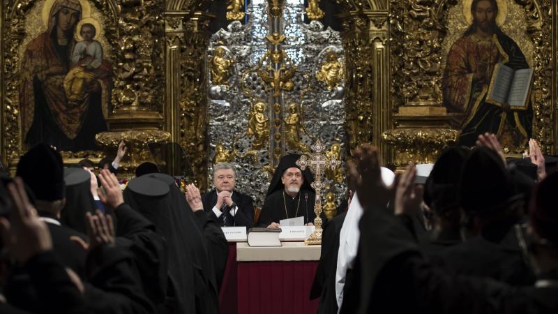 Ukrainian President Petro Poroshenko attends a synod of three Ukrainian Orthodox churches to elect leadership of a new unified church in the St. Sophia Cathedral in Kiev, Ukraine. Ukrainian President Petro Poroshenko attends a synod of three Ukrainian Orthodox churches to elect leadership of a new unified church in the St. Sophia Cathedral in Kiev, Ukraine.