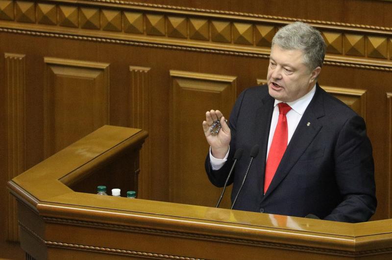 Ukrainian President Petro Poroshenko gestures during a parliament session in Kiev on Monday. Ukrainian President Petro Poroshenko gestures during a parliament session in Kiev on Monday.