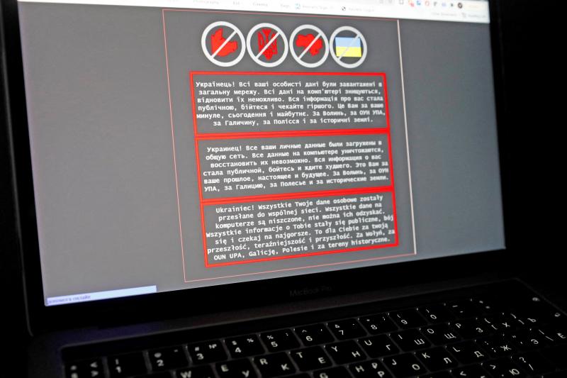 A laptop screen displays a warning message in Ukrainian, Russian and Polish that appeared on the official website of the Ministry of Foreign Affairs of Ukraine after a massive cyberattack on Friday. A laptop screen displays a warning message in Ukrainian, Russian and Polish that appeared on the official website of the Ministry of Foreign Affairs of Ukraine after a massive cyberattack on Friday.