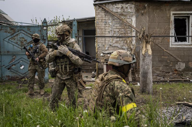 Ukrainian National Guard patrol during a reconnaissance mission in a recently retaken village on the outskirts of Kharkiv, east Ukraine, on Saturday. Ukrainian National Guard patrol during a reconnaissance mission in a recently retaken village on the outskirts of Kharkiv, east Ukraine, on Saturday.