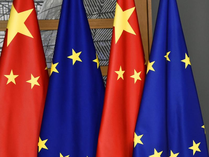 FILE - EU and Chinese flags are seen at the Europa building in Brussels, Tuesday, Dec. 17, 2019 (John Thys/Pool Photo via AP, File) FILE - EU and Chinese flags are seen at the Europa building in Brussels, Tuesday, Dec. 17, 2019 (John Thys/Pool Photo via AP, File)