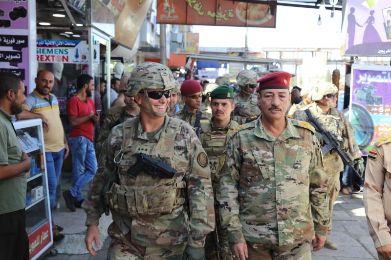 U.S. Army Lt. Gen. Paul Funk (left), and Iraqi Maj. Gen. Najm Abdullah al-Jibouri, walk through a busy market in Mosul, Iraq, on Oct. 4. U.S. forces in Iraq, Syria and Afghanistan have been increasing this year under President Trump, going from about 18,0 U.S. Army Lt. Gen. Paul Funk (left), and Iraqi Maj. Gen. Najm Abdullah al-Jibouri, walk through a busy market in Mosul, Iraq, on Oct. 4. U.S. forces in Iraq, Syria and Afghanistan have been increasing this year under President Trump, going from about 18,0