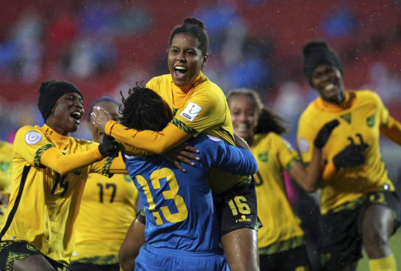 Jamaica's Reggae Girlz celebrate winning a penalty kick shootout against Panama to advance to this year's Women's World Cup. Jamaica's Reggae Girlz celebrate winning a penalty kick shootout against Panama to advance to this year's Women's World Cup.