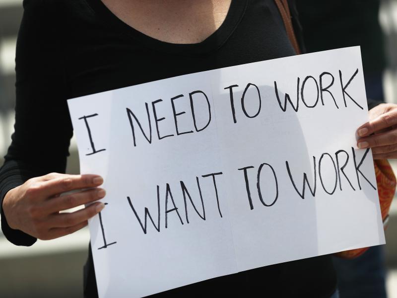 A protester holds a sign to protest measures in Miami to close indoor seating amid a rise in coronavirus cases. The number of unemployment claims rose for a second week, reinforcing concerns about the economy. A protester holds a sign to protest measures in Miami to close indoor seating amid a rise in coronavirus cases. The number of unemployment claims rose for a second week, reinforcing concerns about the economy.