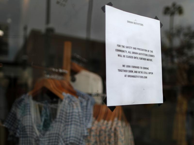 An Urban Outfitters store displays a closed sign in Santa Monica, Calif. With businesses shutting down around the country, a flood of new unemployment claims are pouring in. An Urban Outfitters store displays a closed sign in Santa Monica, Calif. With businesses shutting down around the country, a flood of new unemployment claims are pouring in.