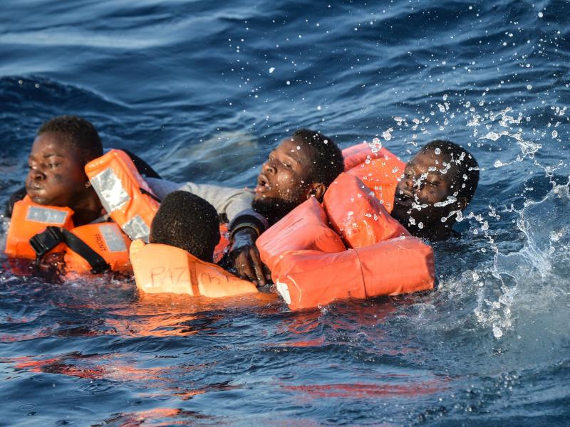 People struggle in the water during a rescue operation of a rescue ship run by Maltese NGO Moas and the Italian Red Cross off the Libyan coast. People struggle in the water during a rescue operation of a rescue ship run by Maltese NGO Moas and the Italian Red Cross off the Libyan coast.