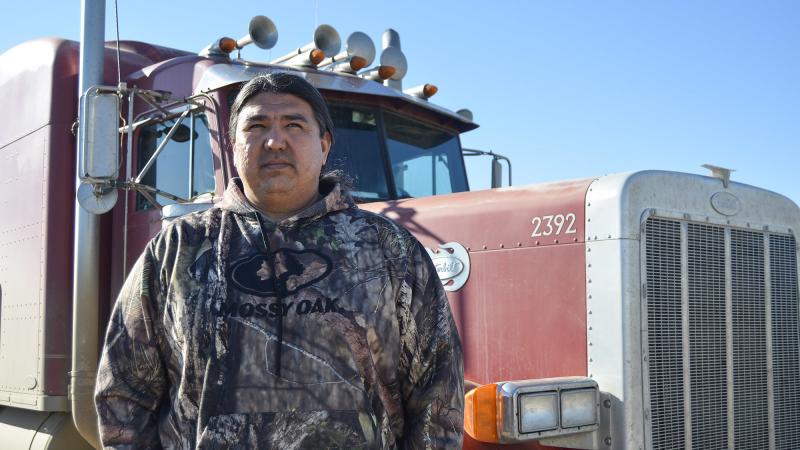 T.J. Plenty Chief stands in front of one of the three semitrucks owned by his company, Red Road Trucking. The trucks operate in the Fort Berthold reservation oil fields, carrying everything from gravel to pipe to water needed for drilling. His business is T.J. Plenty Chief stands in front of one of the three semitrucks owned by his company, Red Road Trucking. The trucks operate in the Fort Berthold reservation oil fields, carrying everything from gravel to pipe to water needed for drilling. His business is