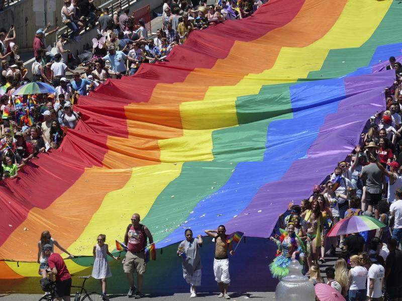 Marchers raise a rainbow flag during the 2018 Pride parade in Salt Lake City. Late Tuesday, state regulators implemented a ban on "conversion therapy" aimed at changing the sexual orientation or gender identity of LGBTQ young people. Marchers raise a rainbow flag during the 2018 Pride parade in Salt Lake City. Late Tuesday, state regulators implemented a ban on "conversion therapy" aimed at changing the sexual orientation or gender identity of LGBTQ young people.