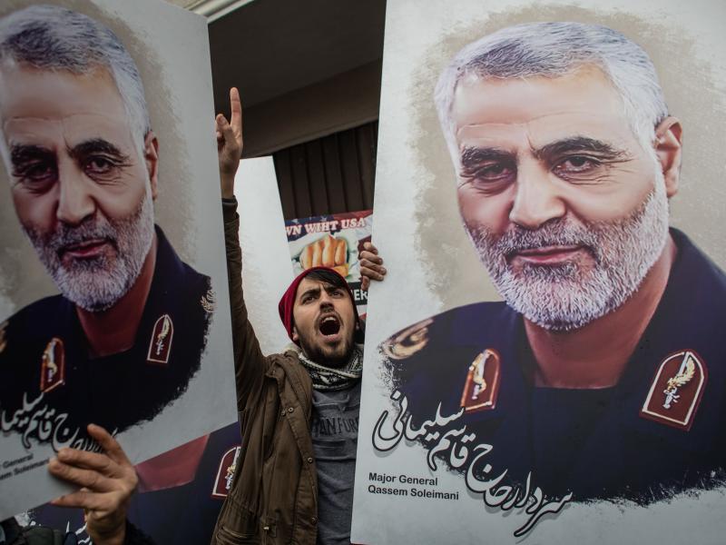People hold posters showing the portrait of Maj. Gen. Qassem Soleimani at a protest outside the U.S. Consulate on Jan. 5 in Istanbul, Turkey. People hold posters showing the portrait of Maj. Gen. Qassem Soleimani at a protest outside the U.S. Consulate on Jan. 5 in Istanbul, Turkey.