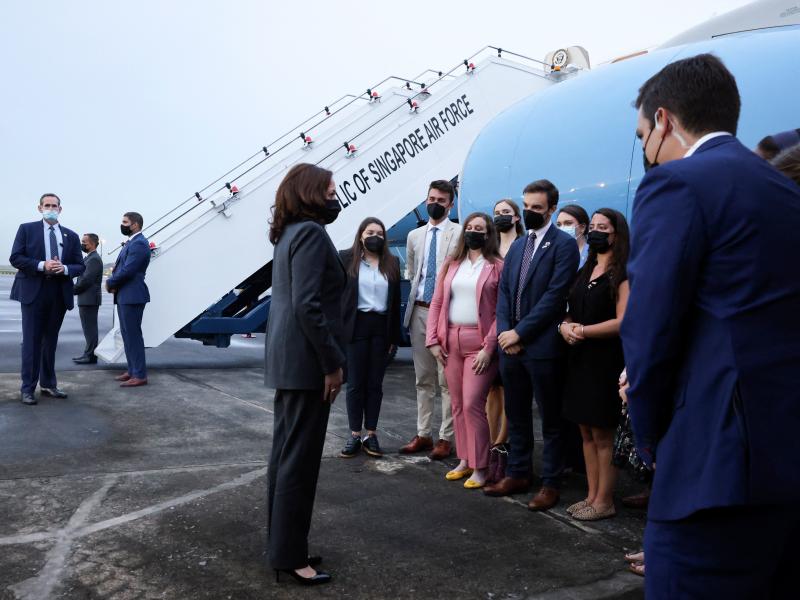 Vice President Harris (center) speaks with U.S. personnel as she departs Tuesday from Singapore on her way to Vietnam. Vice President Harris (center) speaks with U.S. personnel as she departs Tuesday from Singapore on her way to Vietnam.