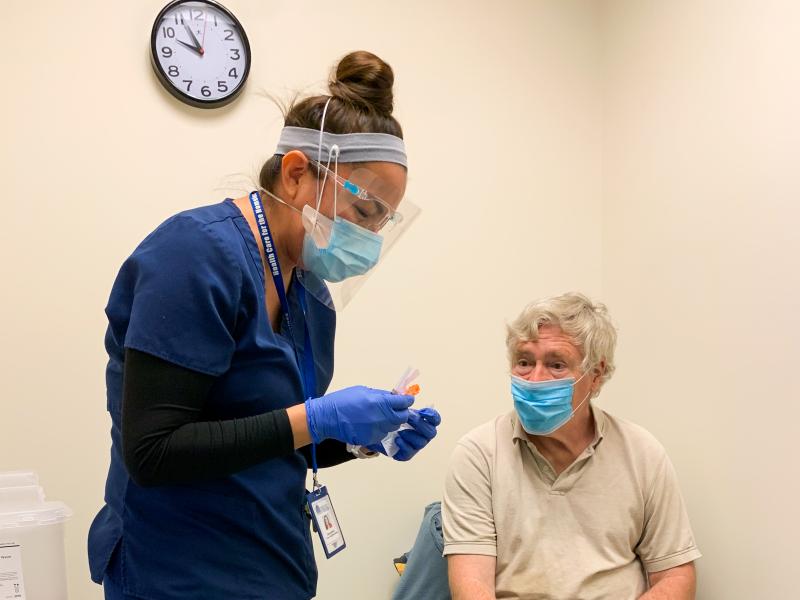Nurse Modesta Littleman vaccinates patient Peter Sulewski in late January, on the first day of vaccinations at a clinic run by Health Care for the Homeless in Baltimore. Nurse Modesta Littleman vaccinates patient Peter Sulewski in late January, on the first day of vaccinations at a clinic run by Health Care for the Homeless in Baltimore.