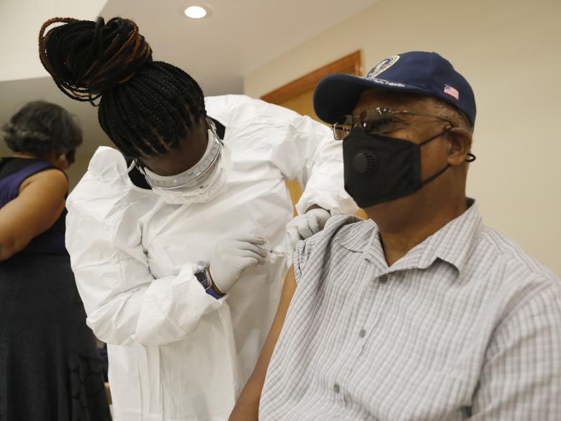 A health care worker administers the COVID-19 vaccine to a resident in Tampa, Fla., on Jan. 10. Seniors in Florida's Leon County have had trouble signing up for the vaccine and a local reporter tried to help them. A health care worker administers the COVID-19 vaccine to a resident in Tampa, Fla., on Jan. 10. Seniors in Florida's Leon County have had trouble signing up for the vaccine and a local reporter tried to help them.