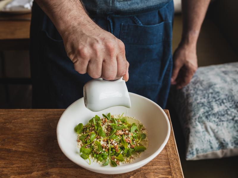 Chef Jeremy Fox's inventive dish: double-chucked spring peas sprinkled with white chocolate and roasted macadamia nuts. It's served with a bit of pea broth poured on the side, "to retain the crunch." Each pea is shucked, blanched and squeezed to get the h Chef Jeremy Fox's inventive dish: double-chucked spring peas sprinkled with white chocolate and roasted macadamia nuts. It's served with a bit of pea broth poured on the side, "to retain the crunch." Each pea is shucked, blanched and squeezed to get the h