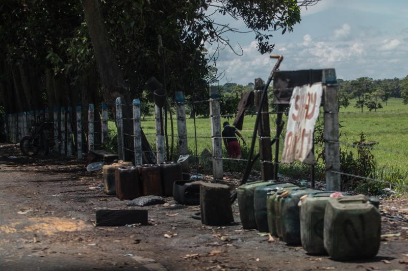 Contraband fuel sits on the side of a road in Puerto Santander, Colombia, on May 31, 2019. The Venezuelan government's lack of cash to import gasoline combined with U.S. sanctions targeting the oil sector have led to chronic fuel shortages in Venezuela. T Contraband fuel sits on the side of a road in Puerto Santander, Colombia, on May 31, 2019. The Venezuelan government's lack of cash to import gasoline combined with U.S. sanctions targeting the oil sector have led to chronic fuel shortages in Venezuela. T