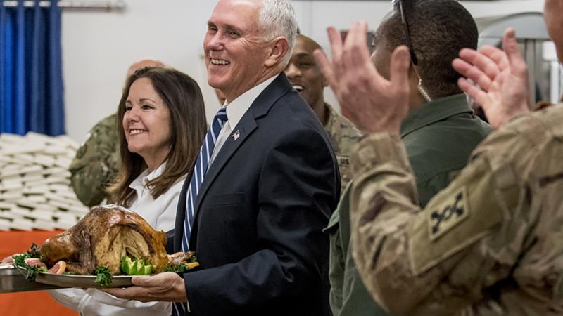 Vice President Mike Pence and his wife Karen Pence arrive with turkey to serve to U.S. troops at Al Asad Air Base, Iraq, Saturday, Nov. 23, 2019. Vice President Mike Pence and his wife Karen Pence arrive with turkey to serve to U.S. troops at Al Asad Air Base, Iraq, Saturday, Nov. 23, 2019.
