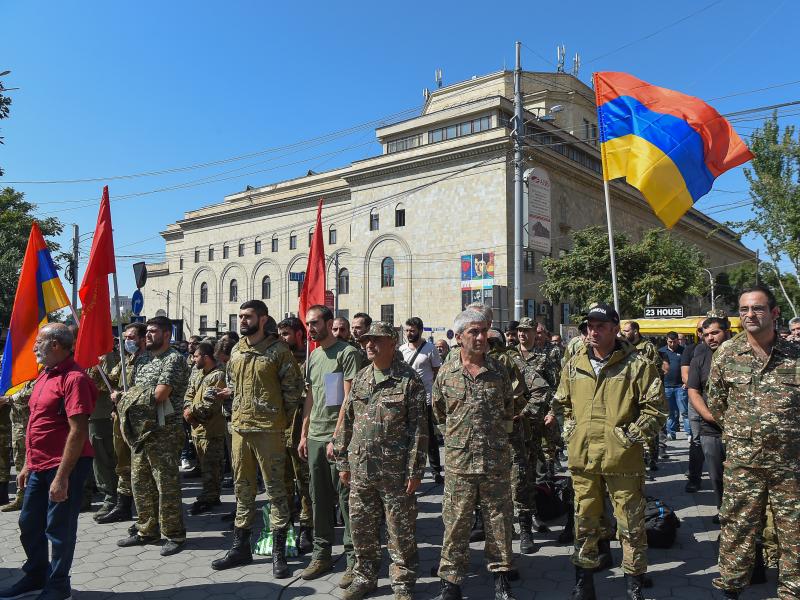 Servicemen and members of the Armenian Revolutionary Federation gather after the Armenian government declared martial law and military mobilization amidst growing conflict with Azerbaijan. Servicemen and members of the Armenian Revolutionary Federation gather after the Armenian government declared martial law and military mobilization amidst growing conflict with Azerbaijan.