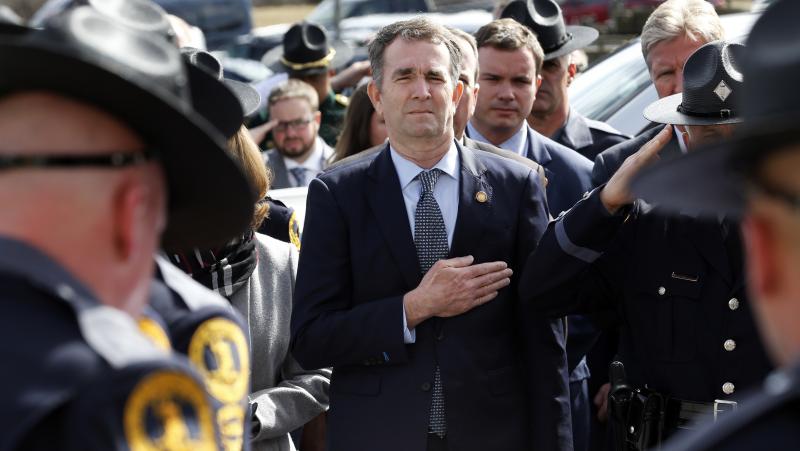 Virginia Gov. Ralph Northam places hand over his heart at a funeral for a state trooper Saturday in Chilhowie, Va., during one of his first public appearances since the blackface scandal broke. Virginia Gov. Ralph Northam places hand over his heart at a funeral for a state trooper Saturday in Chilhowie, Va., during one of his first public appearances since the blackface scandal broke.