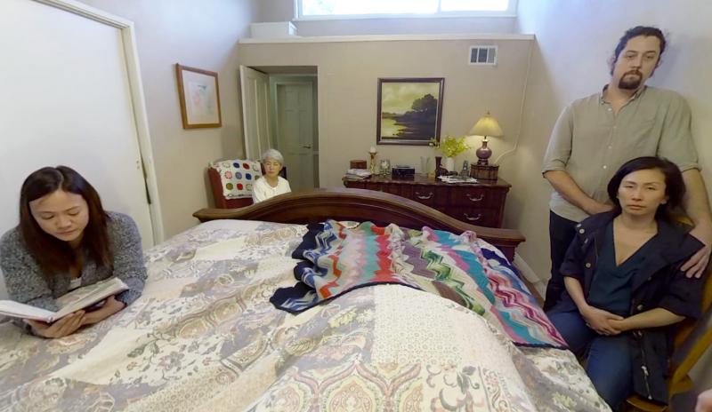 A moment from Embodied Labs' virtual reality video of Clay Crowder, a fictional 66-year-old man with incurable lung cancer. In this scene, Clay's family gathers around his bed, reassuring him that it's OK to let go of life. A moment from Embodied Labs' virtual reality video of Clay Crowder, a fictional 66-year-old man with incurable lung cancer. In this scene, Clay's family gathers around his bed, reassuring him that it's OK to let go of life.