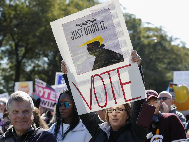 Women gather for a rally and march at Grant Park on Saturday in Chicago to urge voter turnout ahead of the midterm elections. Women gather for a rally and march at Grant Park on Saturday in Chicago to urge voter turnout ahead of the midterm elections.
