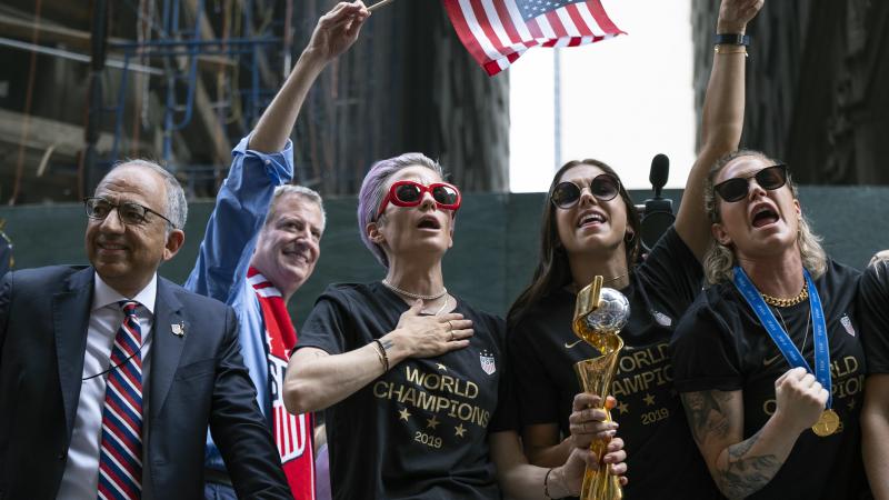 From left, U.S. Soccer Federation President Carlos Cordeiro, New York Mayor Bill de Blasio and soccer players Megan Rapinoe, Alex Morgan and Ashlyn Harris celebrate the U.S. women's soccer team's world championship in New York, during a ticker tape parade From left, U.S. Soccer Federation President Carlos Cordeiro, New York Mayor Bill de Blasio and soccer players Megan Rapinoe, Alex Morgan and Ashlyn Harris celebrate the U.S. women's soccer team's world championship in New York, during a ticker tape parade