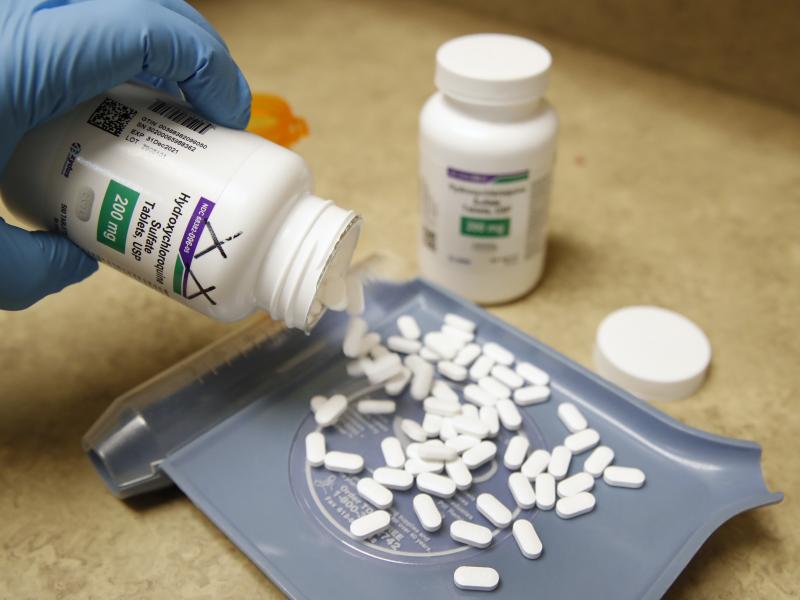 A pharmacy tech pours out pills of hydroxychloroquine May 20 at Rock Canyon Pharmacy in Provo, Utah, on May 20, 2020. After a study found COVID-19 patients using the drug were dying at higher rates, the World Health Organization announced it would suspend A pharmacy tech pours out pills of hydroxychloroquine May 20 at Rock Canyon Pharmacy in Provo, Utah, on May 20, 2020. After a study found COVID-19 patients using the drug were dying at higher rates, the World Health Organization announced it would suspend