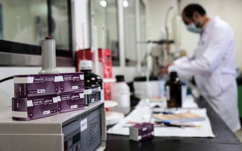 Boxes containing vials of remdesivir at a pharmaceutical company in Giza, Egypt. Boxes containing vials of remdesivir at a pharmaceutical company in Giza, Egypt.