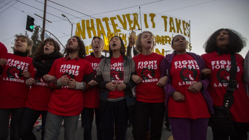 Striking McDonald's restaurant employees lock arms during nationwide "Fight for $15 Day of Disruption" protests. Striking McDonald's restaurant employees lock arms during nationwide "Fight for $15 Day of Disruption" protests.